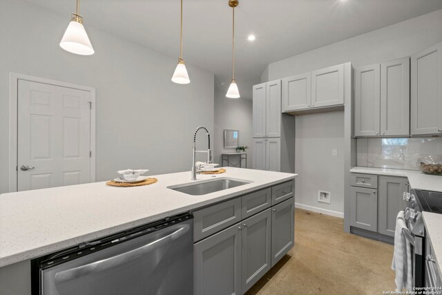 kitchen with gray cabinetry, sink, decorative light fixtures, decorative backsplash, and appliances with stainless steel finishes