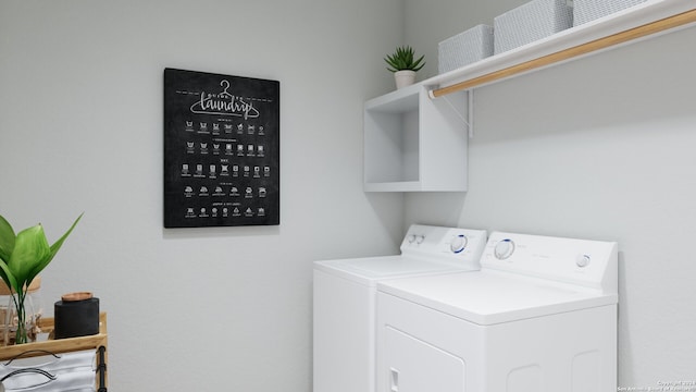 clothes washing area with washer and dryer