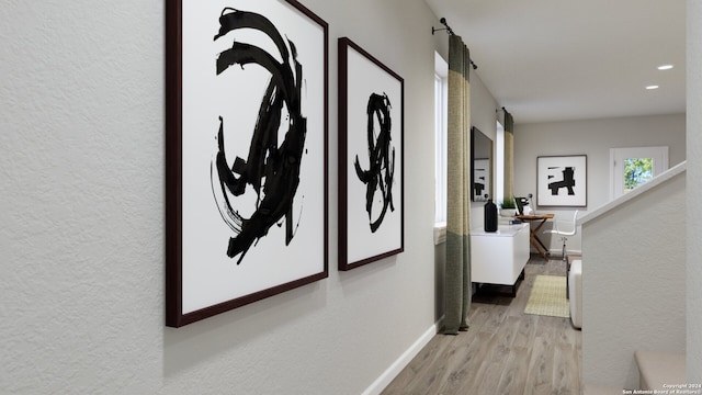 corridor with light hardwood / wood-style flooring