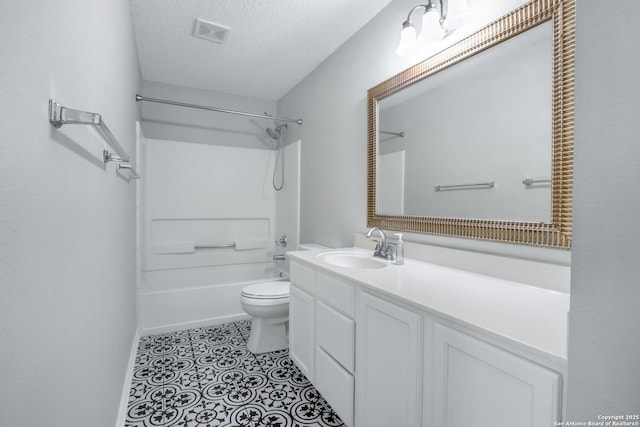 full bathroom featuring shower / tub combination, vanity, a textured ceiling, tile patterned floors, and toilet