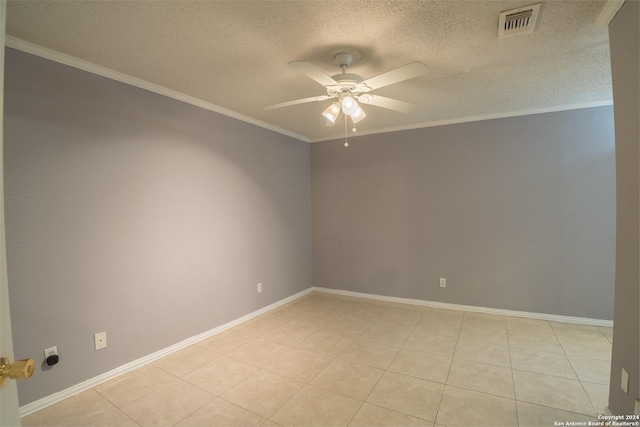 tiled empty room with a textured ceiling, ceiling fan, and ornamental molding