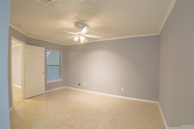 tiled spare room with a textured ceiling, ceiling fan, and crown molding