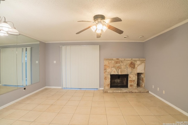 unfurnished living room featuring a stone fireplace, ceiling fan, crown molding, and a textured ceiling