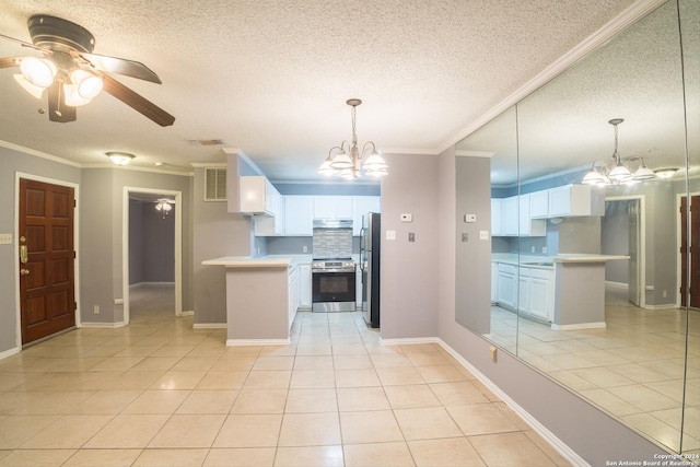 kitchen featuring white cabinets, pendant lighting, ceiling fan with notable chandelier, and appliances with stainless steel finishes