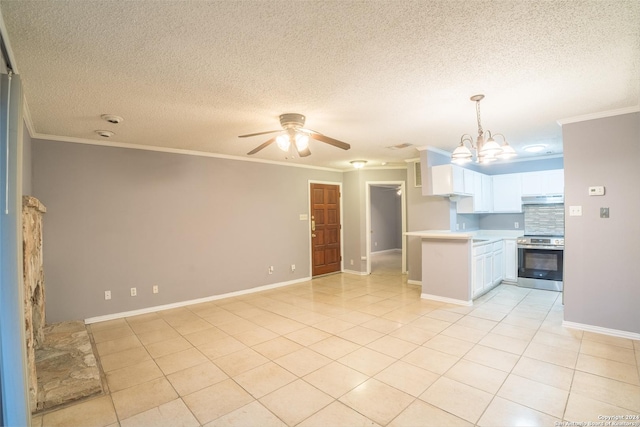 kitchen featuring white cabinetry, tasteful backsplash, decorative light fixtures, stainless steel stove, and ceiling fan with notable chandelier