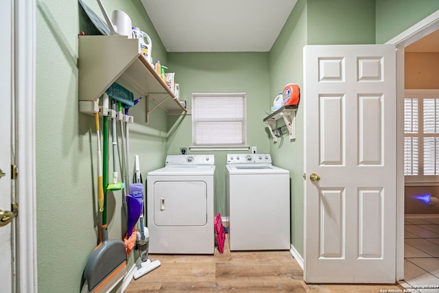 washroom featuring washer and dryer and light wood-type flooring