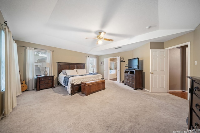 carpeted bedroom featuring ceiling fan and a textured ceiling