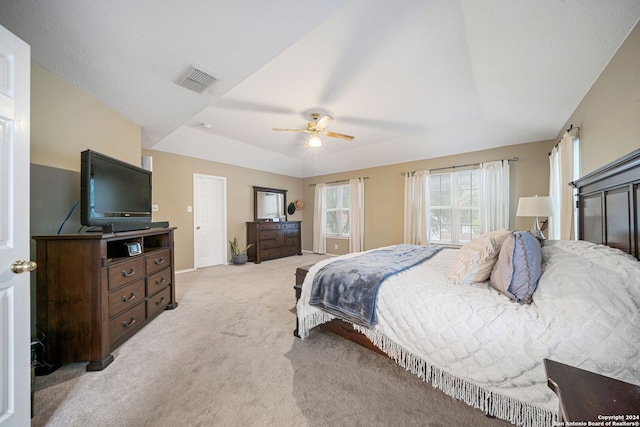 bedroom featuring light colored carpet and ceiling fan