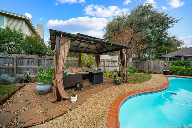 view of pool featuring a gazebo, an outdoor hangout area, and a patio area