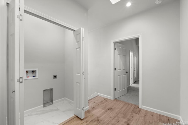 1002 Morningside Dr Unit 6, Terrell Hills, TX 78209 - laundry room with hookup for an electric dryer, hookup for a washing machine, and light hardwood / wood-style floors