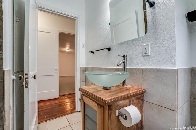 bathroom featuring tile patterned flooring and vanity