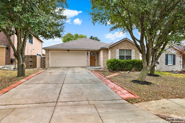 single story home featuring a garage