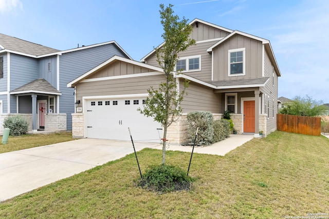 craftsman inspired home with a front lawn and a garage