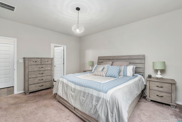 bedroom featuring light colored carpet