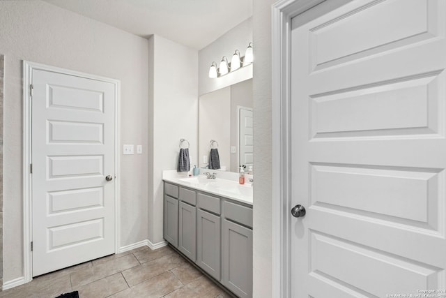 bathroom with tile patterned flooring and vanity