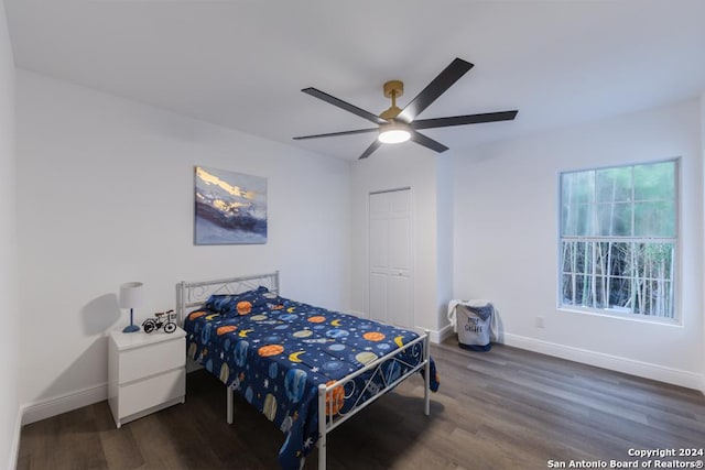 bedroom with ceiling fan and dark wood-type flooring