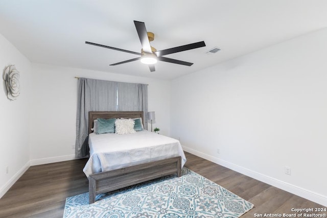 bedroom featuring ceiling fan and dark hardwood / wood-style floors