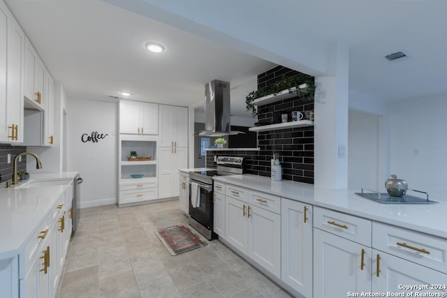 kitchen with white cabinets, stainless steel appliances, tasteful backsplash, and wall chimney exhaust hood