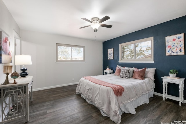 bedroom featuring ceiling fan and dark wood-type flooring