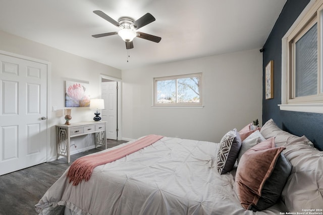 bedroom featuring dark hardwood / wood-style floors and ceiling fan