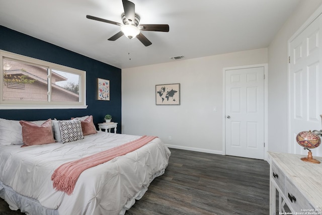 bedroom featuring ceiling fan and dark hardwood / wood-style flooring