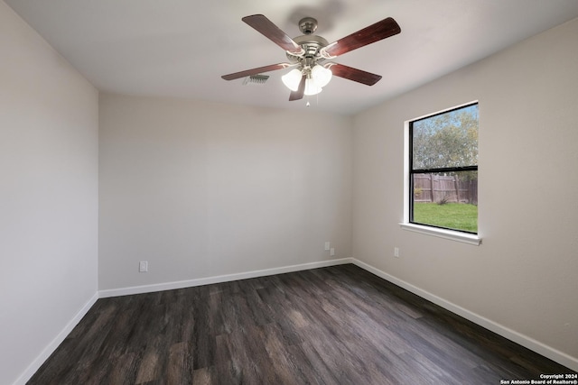 unfurnished room with dark hardwood / wood-style flooring and ceiling fan