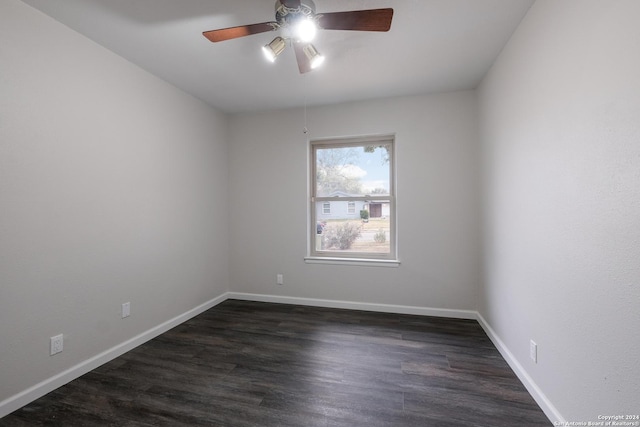 unfurnished room with ceiling fan and dark hardwood / wood-style flooring