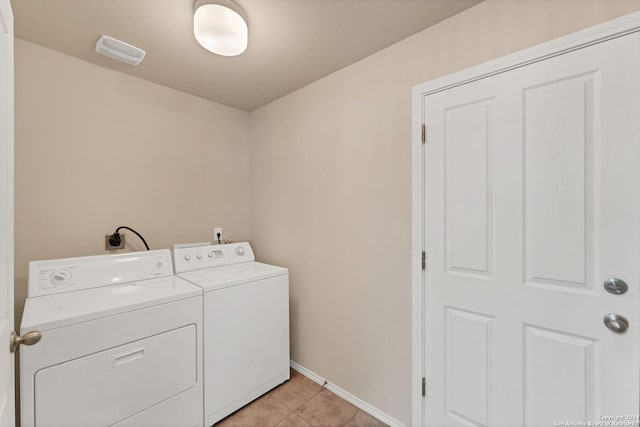 washroom featuring independent washer and dryer and light tile patterned floors