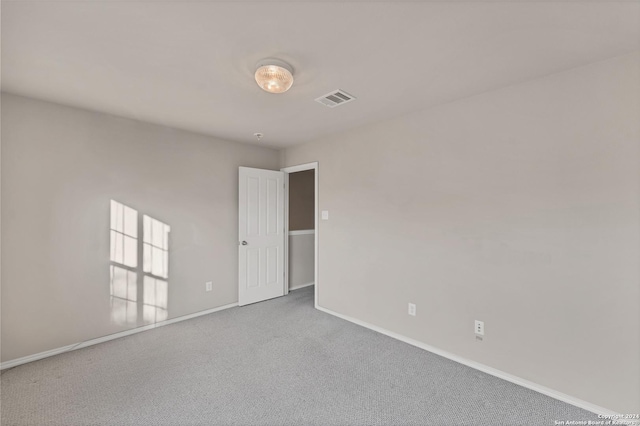 empty room featuring carpet floors