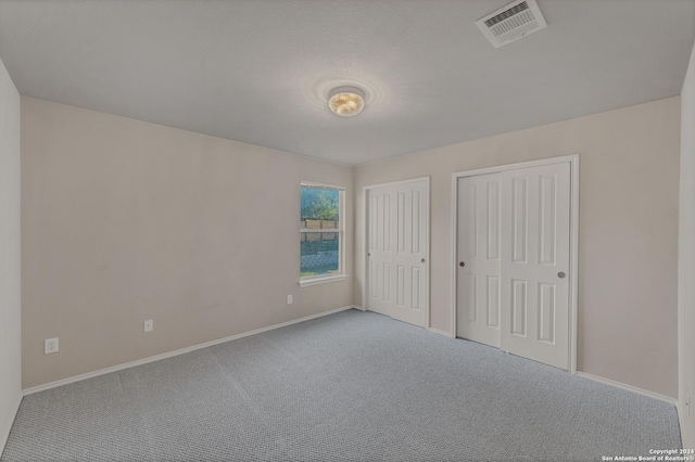 unfurnished bedroom featuring carpet flooring