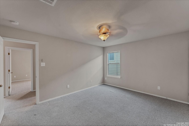 empty room featuring light colored carpet