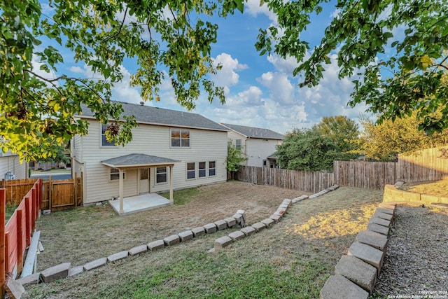 rear view of house with a patio