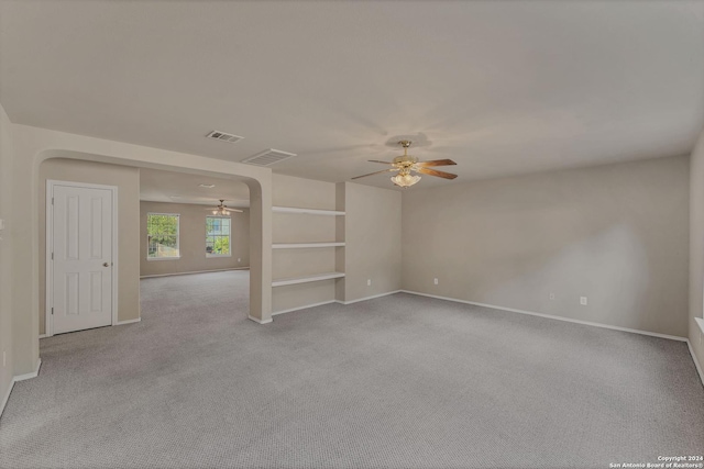 unfurnished living room featuring light colored carpet