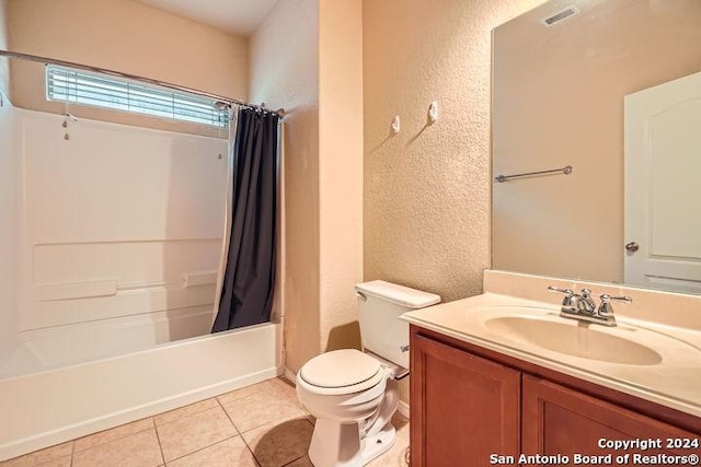 full bathroom featuring tile patterned floors, vanity, shower / bath combo, and toilet