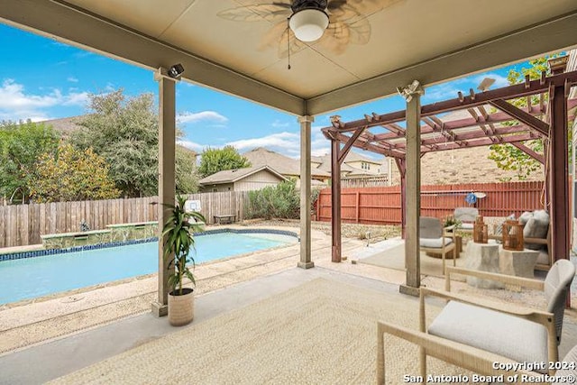 view of pool with a pergola, ceiling fan, and a patio