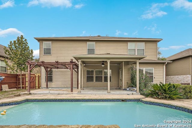 back of house with ceiling fan, a patio area, and a pergola