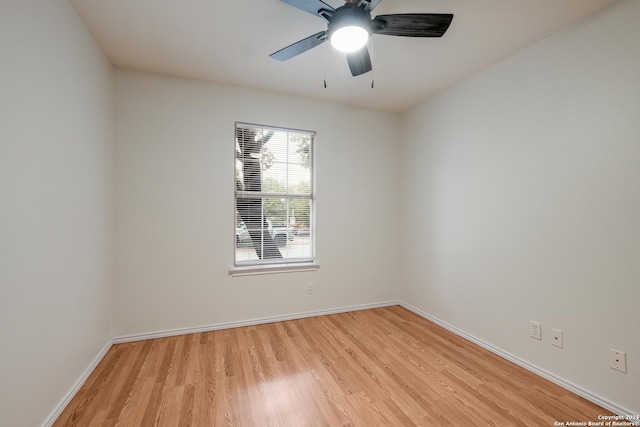 unfurnished room featuring light wood-type flooring and ceiling fan