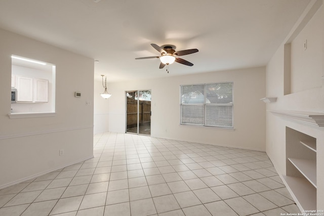 unfurnished living room with light tile patterned floors and ceiling fan