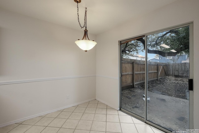 unfurnished dining area with light tile patterned floors