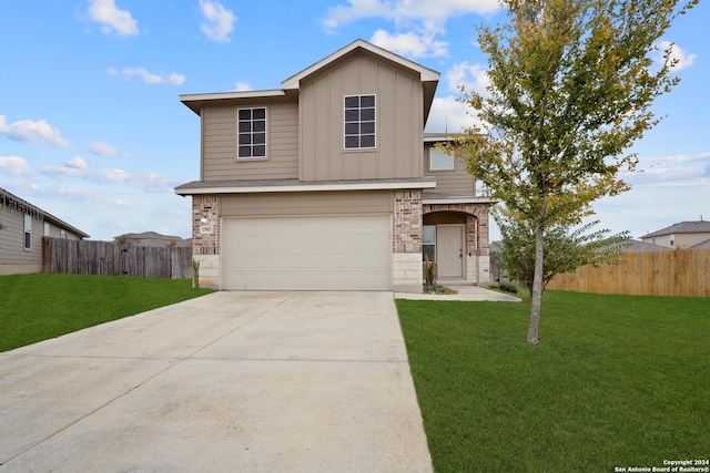 view of front facade with a front yard and a garage