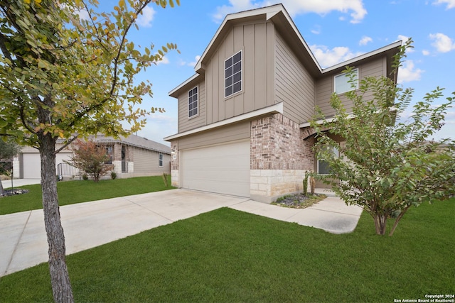 view of front of home with a garage and a front lawn