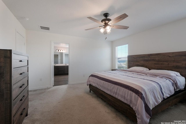 carpeted bedroom featuring connected bathroom and ceiling fan