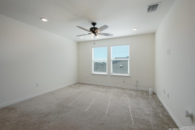 carpeted empty room with ceiling fan