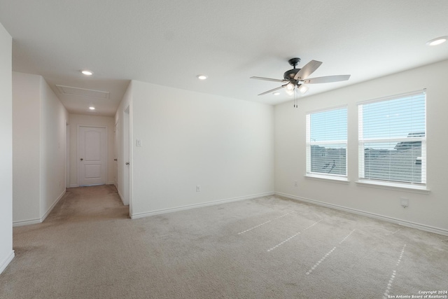 carpeted empty room featuring ceiling fan