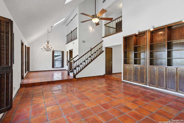 unfurnished living room featuring a textured ceiling, tile patterned flooring, high vaulted ceiling, and ceiling fan with notable chandelier