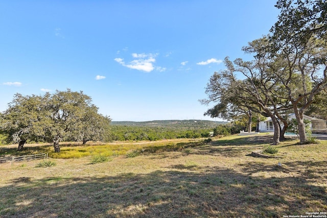 view of yard with a rural view