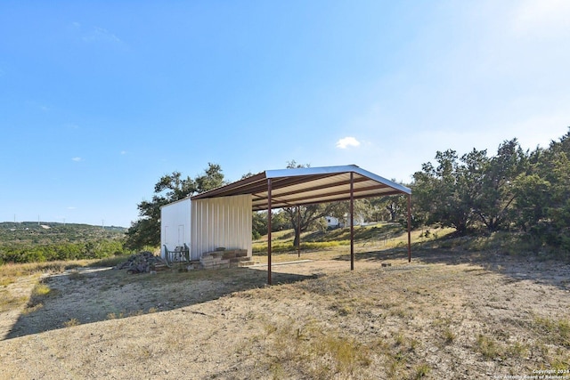 view of outdoor structure with a carport