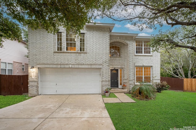 view of front of house with a front lawn and a garage