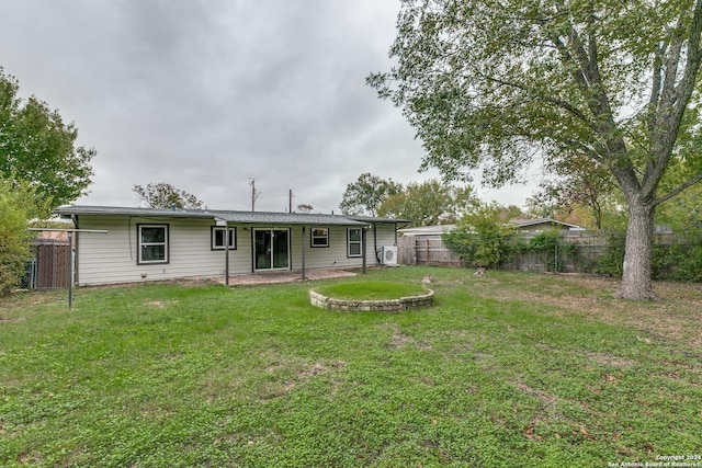 back of house with a yard