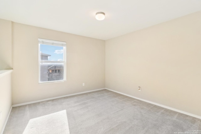 empty room featuring light colored carpet